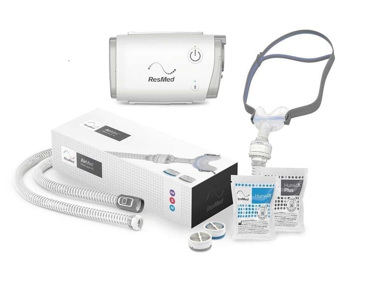 ResMed CPAP machine with humidifier, tubing, nasal mask, and accessories for sleep apnea treatment