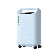Light blue portable dehumidifier with top handle, control panel, and rolling casters on white background