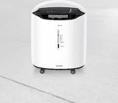 White cylindrical oxygen concentrator medical device with black control panel and caster wheels